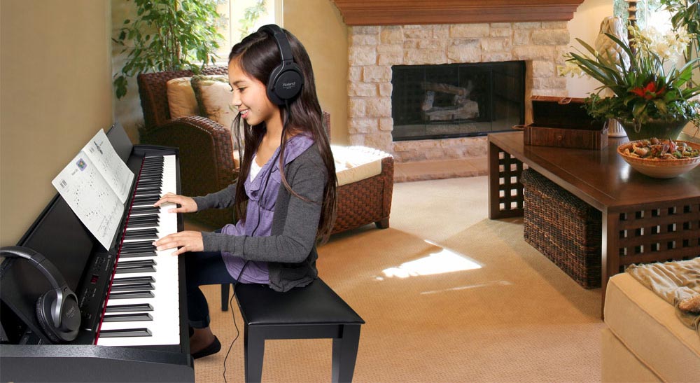 Student Playing Roland F-120 Digital Piano