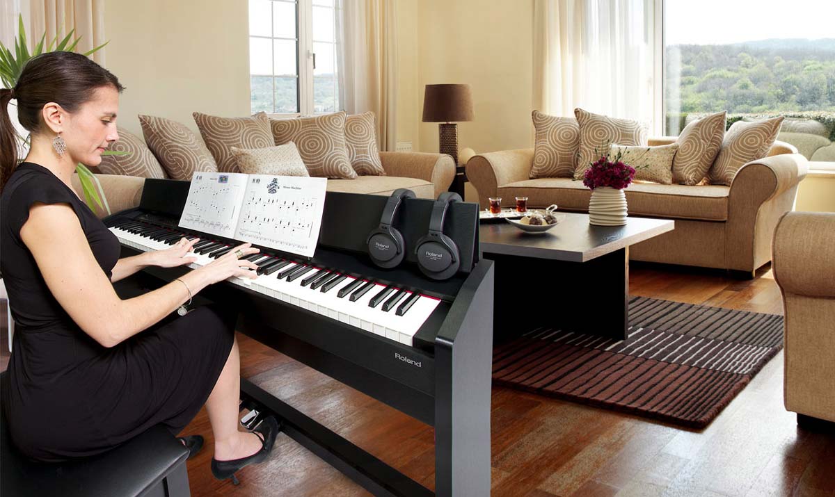 Woman Playing Roland F-120 Digital Piano